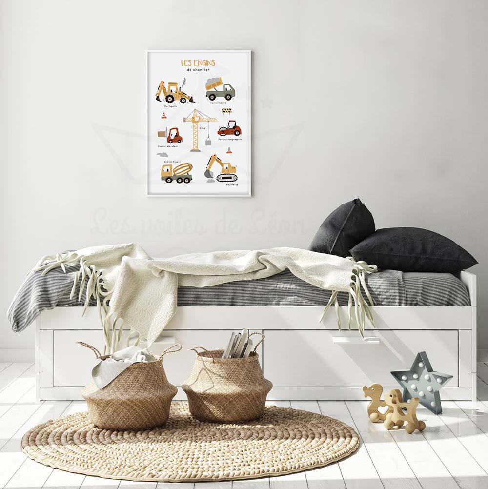 Gros plan sur la texture du papier et les détails des engins de construction sur une affiche pour enfant.